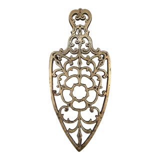 Brass Toned Cast Trivet With Ornate Victorian Design. For Sale
