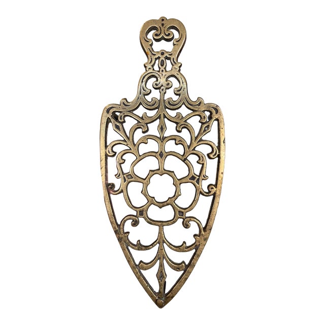 Brass Toned Cast Trivet With Ornate Victorian Design. For Sale
