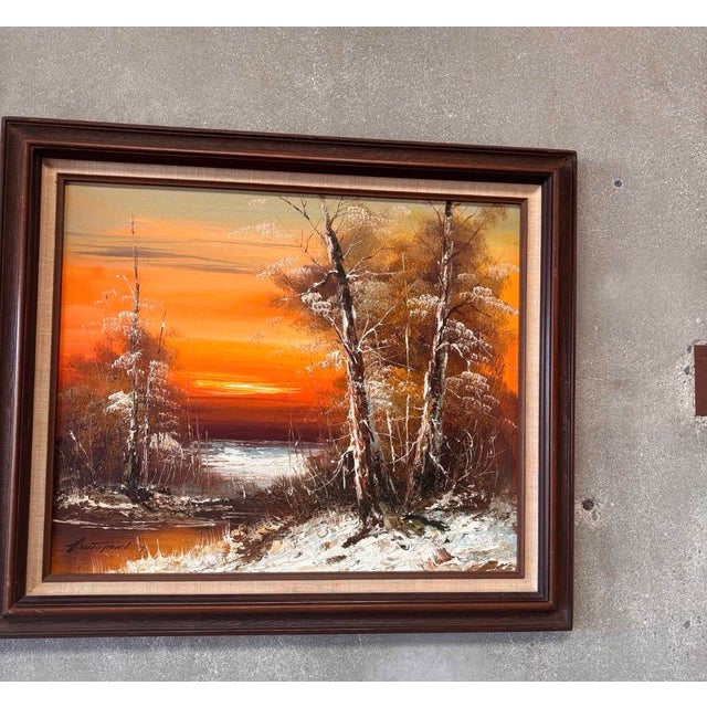 Vintage oil on canvas depicting a serene winter landscape at sunset, rendered in rich orange, rust and earthy tones with...