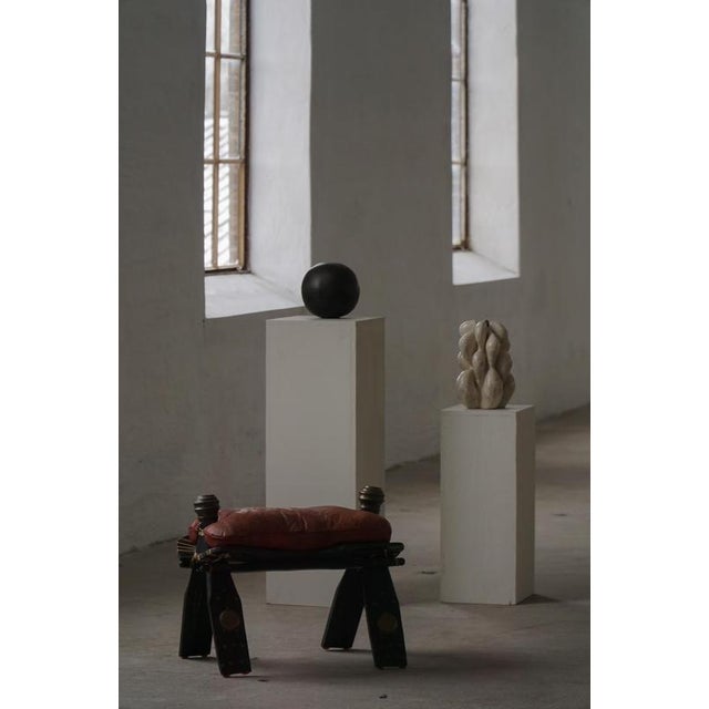 This 20th-century upholstered footstool originates from North Africa, Morocco, and reflects the region’s long tradition of...