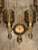 A striking and increasingly scarce set of three original Art Deco wall sconces, beautifully executed in polychrome with...