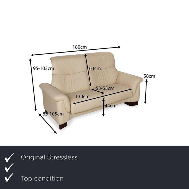 The Paradise Sofa from Stressless is covered in beige genuine leather and stands on floor-to-ceiling side panels. The...