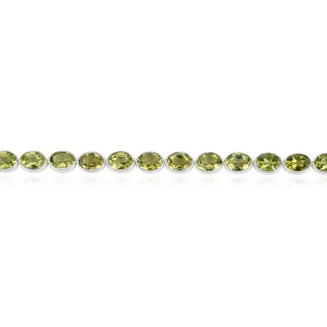 Art Deco Oval Cut Peridot Gemstone Tennis Bracelet in 925 Sterling Silver by Caratandher For Sale - Image 3 of 11