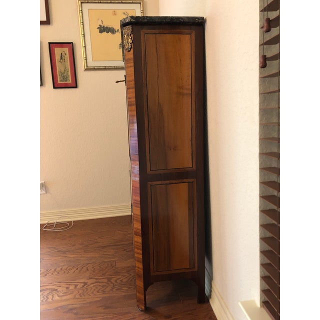 Writing desk (secrètaire) with cut sides in rosewood veneer tabled with frames of amaranth lines. Having one top drawer,...