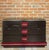 Italian design chest of drawers from the 70s, black wood, chrome trim and absolutely adorable raspberry velvet half-moon...