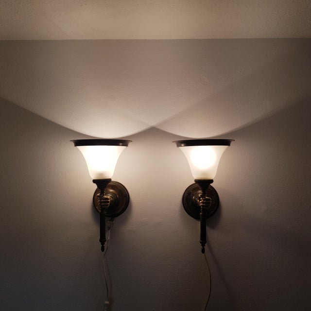This set consists of two high-quality wall lamps that represent the shape of a hand in a neoclassical style. Made from...