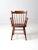 This is a mid-20th century Conant Ball dining chair. The sleek arm chair is a modern Windsor style chair with spindle...