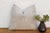 A geometric medallion band runs through the center of this handcrafted Moroccan cactus silk pillow, bordered by fine...