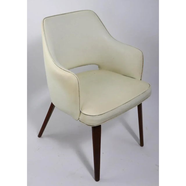 Stylish Mid Century Arm Chair, Lounge Chair, in white vinyl, with bent plywood legs. In the style of Thonet, signed Brody....