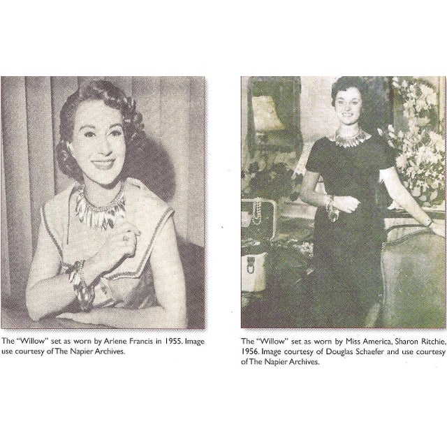 1955-1956 goldtone Florentine finish leaf charms on a chain bracelet with fold over clasp. Marked "NAPIER" on the back of...