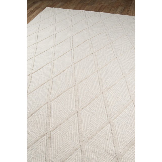 COZY VIBE: A pastel color palette and plush fibers make this rug a perfect floorcovering for rooms seeking a soft...
