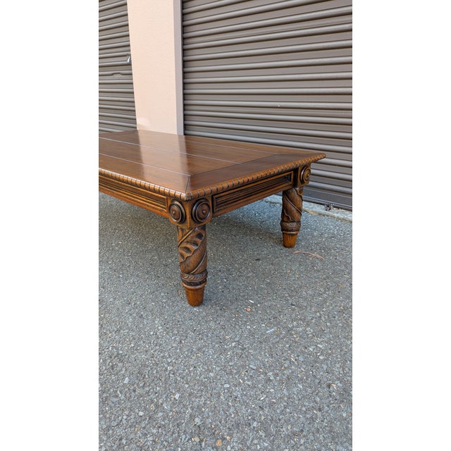 Ralph Lauren mahogany cocktail table from the Dutton Collection. Crafted from solid wood with a warm mahogany finish, this...