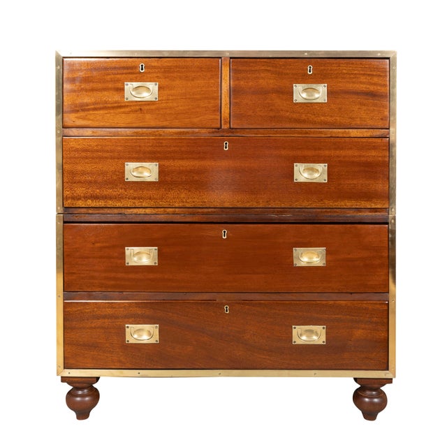 In two sections meant for transportation. The top with cast brass edge over two short and one long drawer. The lower...