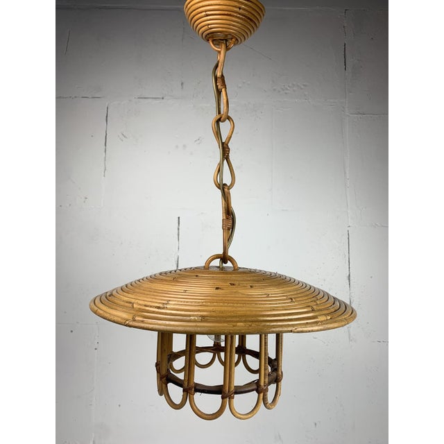 A wonderful rare "birdcage" pencil or split reed rattan wicker bamboo pendant lamp, Italy 1970s. The rattan is still in...