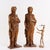 Pair of carved light walnut wood sculptures depicting female figures. This piece is attributed to the mentioned...