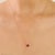 This elegant pendant necklace features a 1-carat heart-shaped natural ruby, approximately 5.6x5 mm in size, set in a 14K...