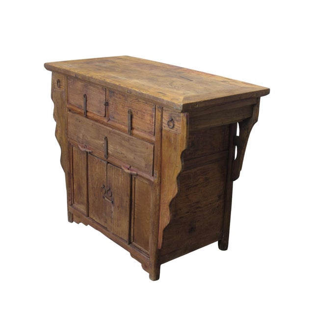 Made in 1876 from solid poplar wood, this antique sideboard features 3 upper drawers detailed with hand-carved floral...