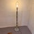 Sleek and sophisticated, this vintage floor lamp blends polished chrome with warm brass accents for a timeless modern...