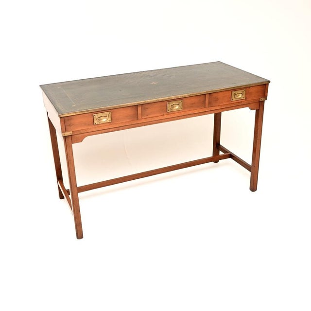 A wonderful antique military campaign style desk in yew wood, dating from around the 1950’s period. It is of excellent...