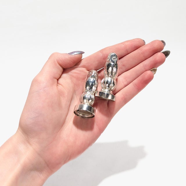 A fine pair of figural silver salt & pepper shakers. By Georg Jensen. In sterling silver. Model. no. 36A. Designed by...