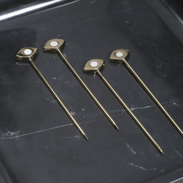 A sophisticated addition to any barware collection, this set of four cocktail picks is crafted from polished brass and...