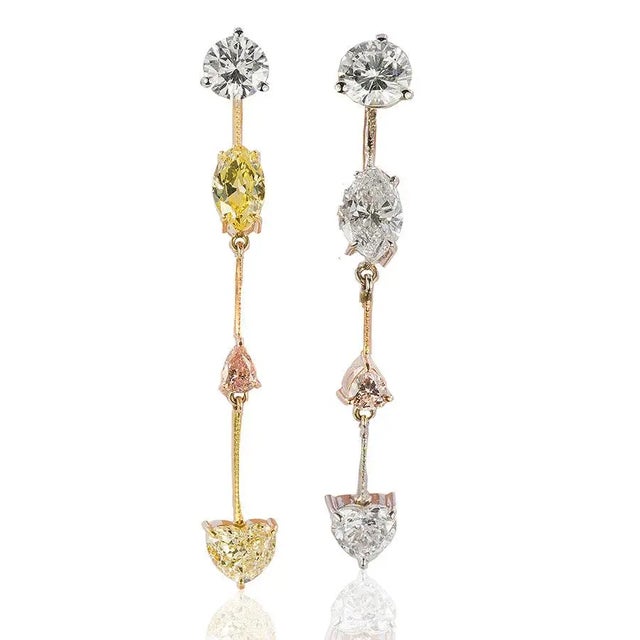 Platinum Earrings with 1 GIA 0.54 Fancy Yellow SI1 Marquis, 0.65 F color VS clarity marquius, 0.47 Fancy Yellow Heart,...