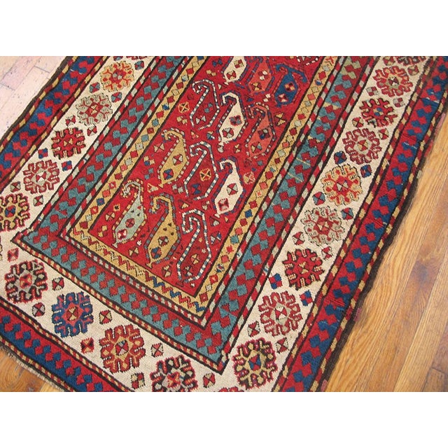Antique Caucasian-Talish rug, size: 3'4" x 7'0". Antique Kazak Small Scatter Size Wool Coral Rug, Circa Date: 1880s. This...