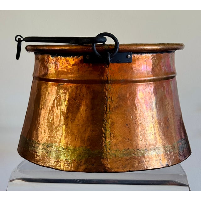 A copper cauldron with wrought iron handle. Hand crafted to endure years of use. French from the 19th century.