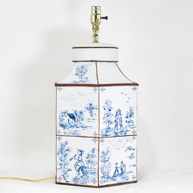 A striking pair of hand-painted Dutch imitation tea caddy lamps, featuring octagonal forms decorated in a traditional...