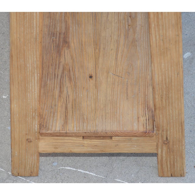 This custom built console table is made using reclaimed, vintage wood. It has a shelf and two drawers that can be opened...