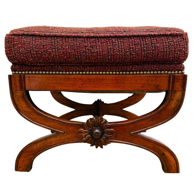 Pair of English Regency ottomans featuring a stately Neoclassical-inspired design with sturdy, sweeping X-frame bases in a...