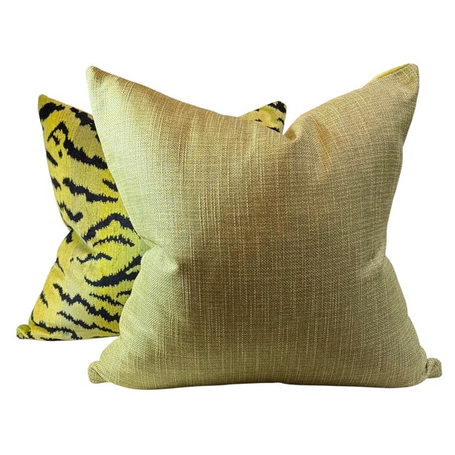 A luxurious pair of Scalamandré tiger pillows in the sought after green color. The fronts are fashioned from the...