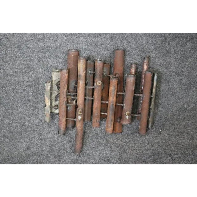 Dimensions- H: 14 1/2in W: 16in D: 6in This Mid-Century Modern metal Brutalist wall art in the manner of Paul Evans is...