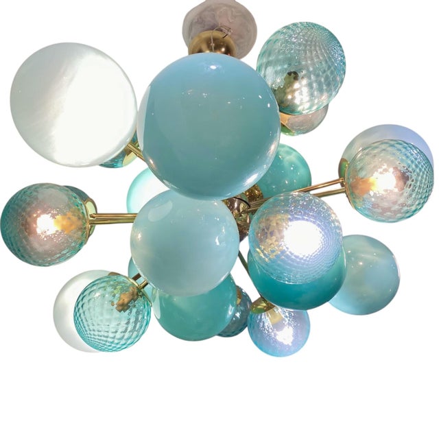 A major novelty and a standout piece: Our iconic blue opaline ball lamp, reimagined in this design that combines the same...