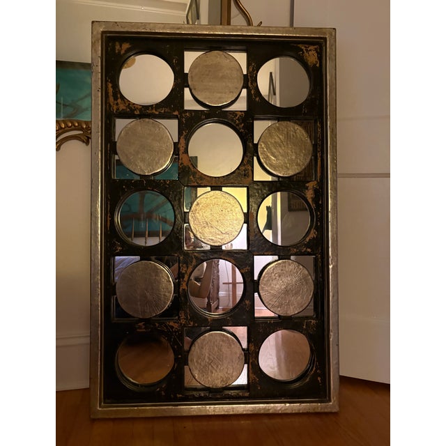 1970s era mirror that combines industrial aesthetic with op art with a distinct geometric design. Silvered exterior and...