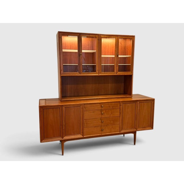 Kipp Stewart for Drexel Declaration two piece Mid Century Modern walnut credenza, buffet, hutch, with interior lighting in...