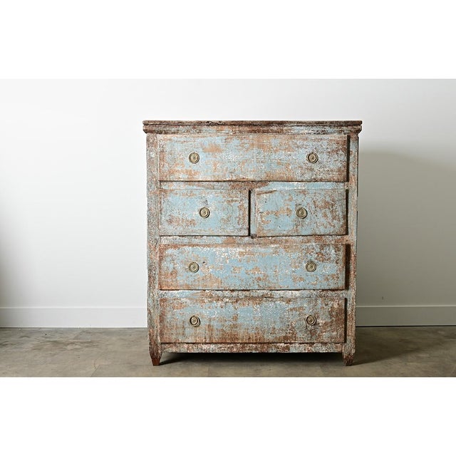 This massive antique chest of drawers from Catalonia (Spain) exhibits a pure tactile joy in how the aqua blue paint has...