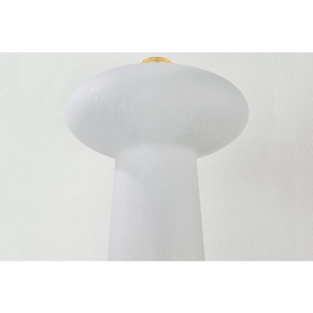Petite and playful, the Fords table lamp adds charm to smaller spaces like bookshelves. Its cloud-like, seeded glass...