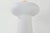 Petite and playful, the Fords table lamp adds charm to smaller spaces like bookshelves. Its cloud-like, seeded glass...