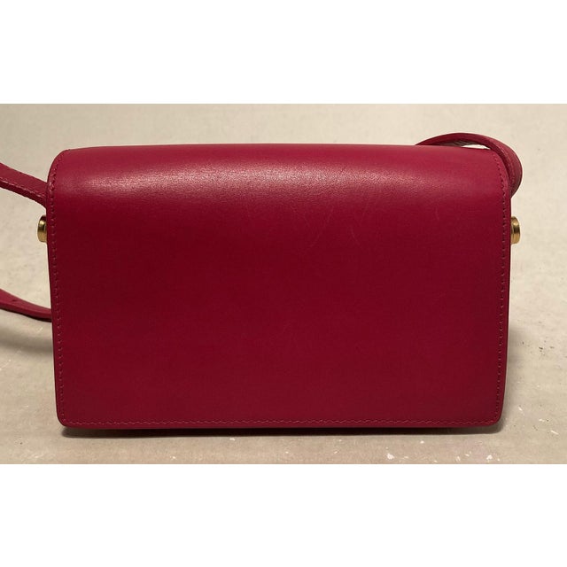 YSL Yves Saint Laurent Pink lulu bag in excellent condition. Smooth pink leather exterior trimmed with gold hardware and...