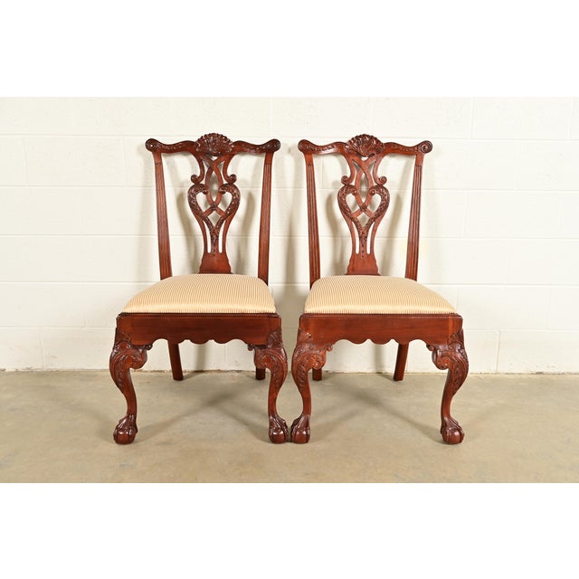 An outstanding pair of Chippendale or Georgian style side chairs or dining chairs By Baker Furniture USA, Circa 1980s...