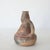 A traditional hand-crafted terracotta jug, known as a Takduht , originating from the Aït Chenacha region of Greater...