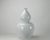 A symbol of immortality and happy life, this large bottle gourd vase with glossy white finish has smooth curving...