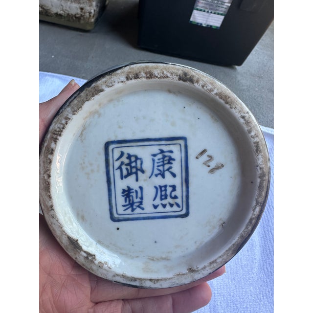 This is an antique Large Early 20th Century Chinese Famille Noir Porcelain Urn. It has beautiful painted details of...