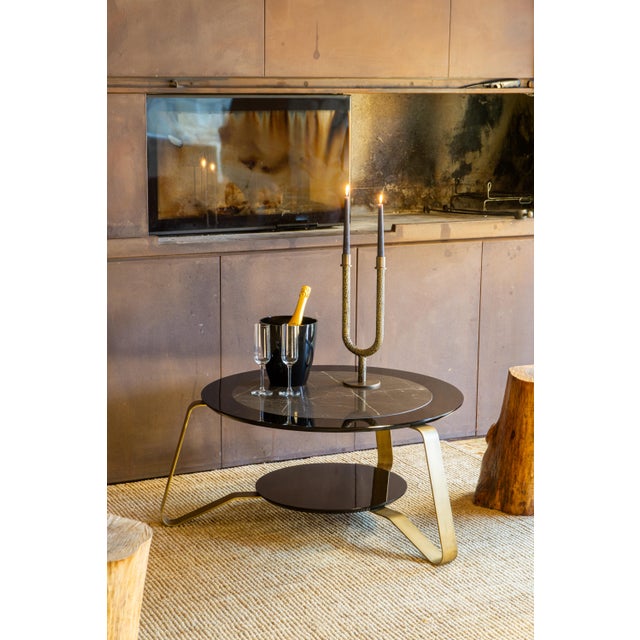 Rigel is a low coffee table made in Italy that combines marble, lacquered wood, and steel in a harmonious composition. The...