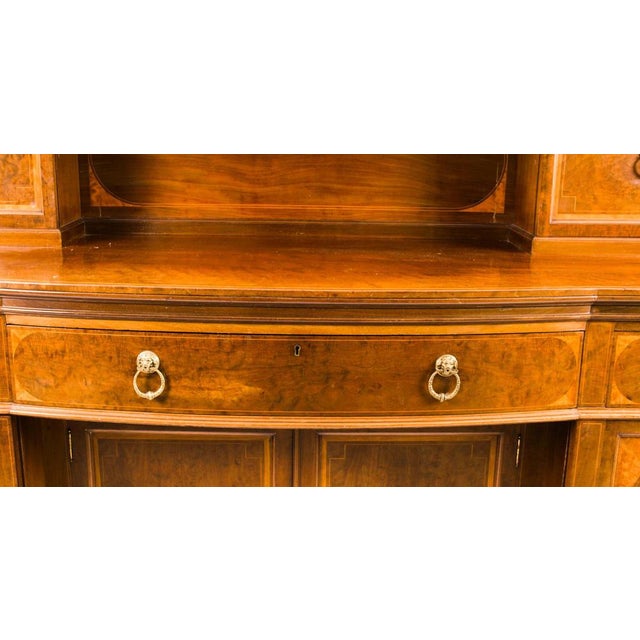 A superb large antique Sheraton Revival flame mahogany and satinwood inlaid bow front sideboard, by "Robson & Sons,...