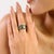 This timeless antique-style band ring is crafted in sterling silver and showcases a striking square emerald design. The...