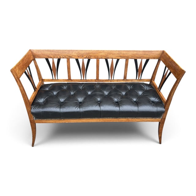 Arts and Crafts–Style This distinctive bench pairs a sculpted wooden frame with a comfortable, button-tufted black leather...
