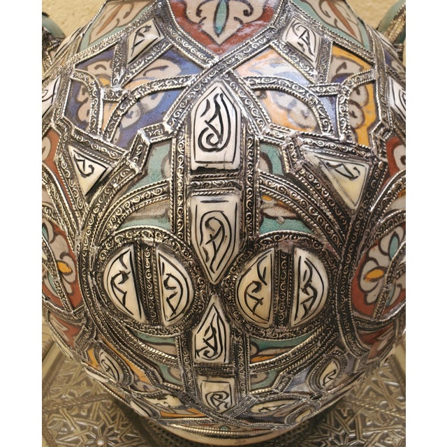 Multi-color! Made in Fez, Morocco, this incredible hand painted metal inlay vase is adorned with resin dots, giving it a...
