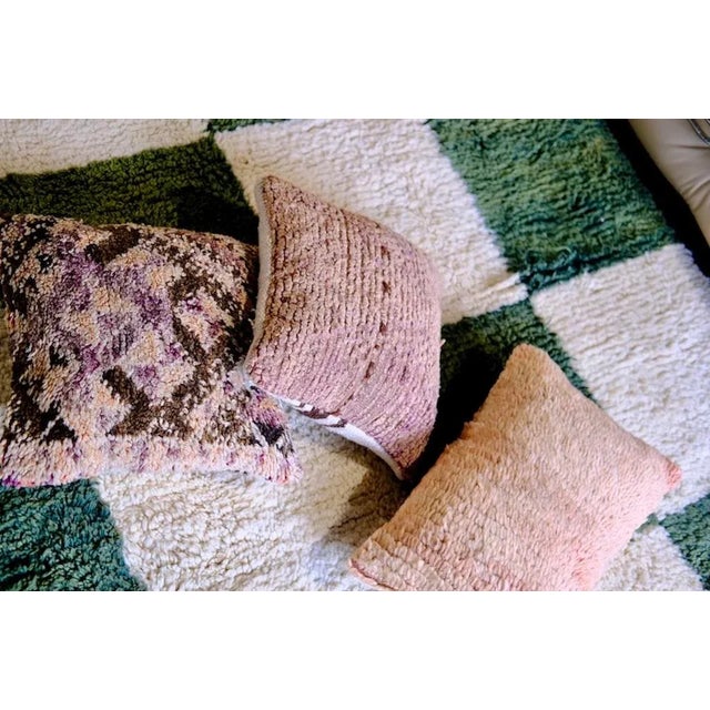 Moroccan rug hand-woven from natural wool with a checkered pattern. Beni Ouarain rugs have become very popular in modern...